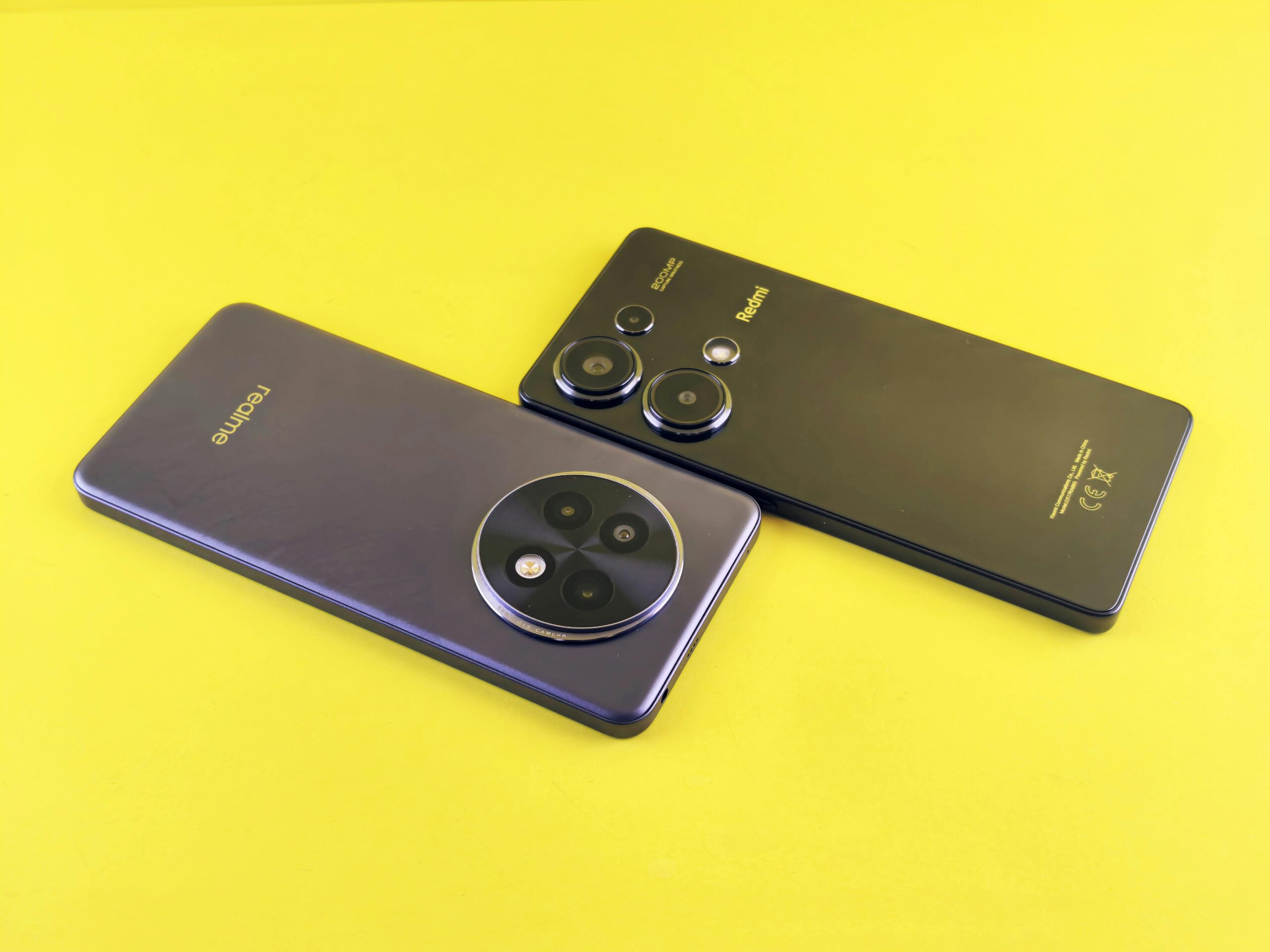 Two modern smartphones in a sleek, minimalist design on a vibrant yellow background.